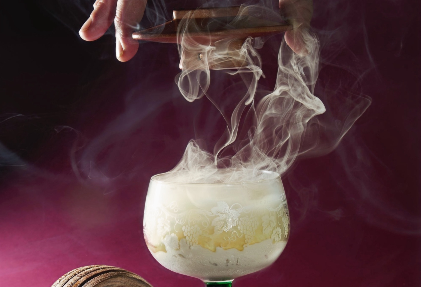 Candlelight and smoke over a dinner table